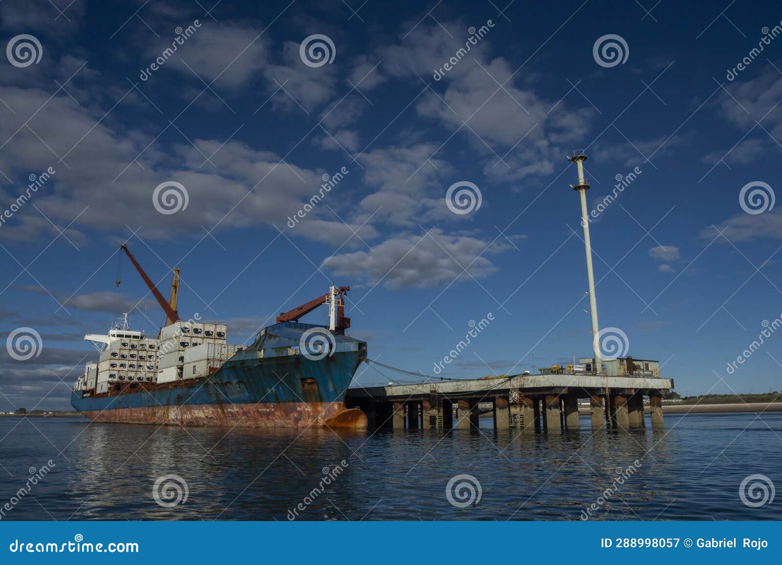 merchant ship moored in the port of san antonio este,