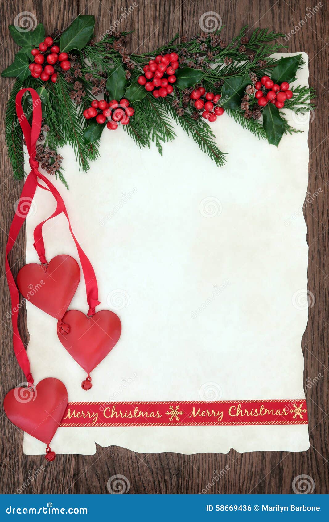 Christmas background border on parchment paper on oak wood with