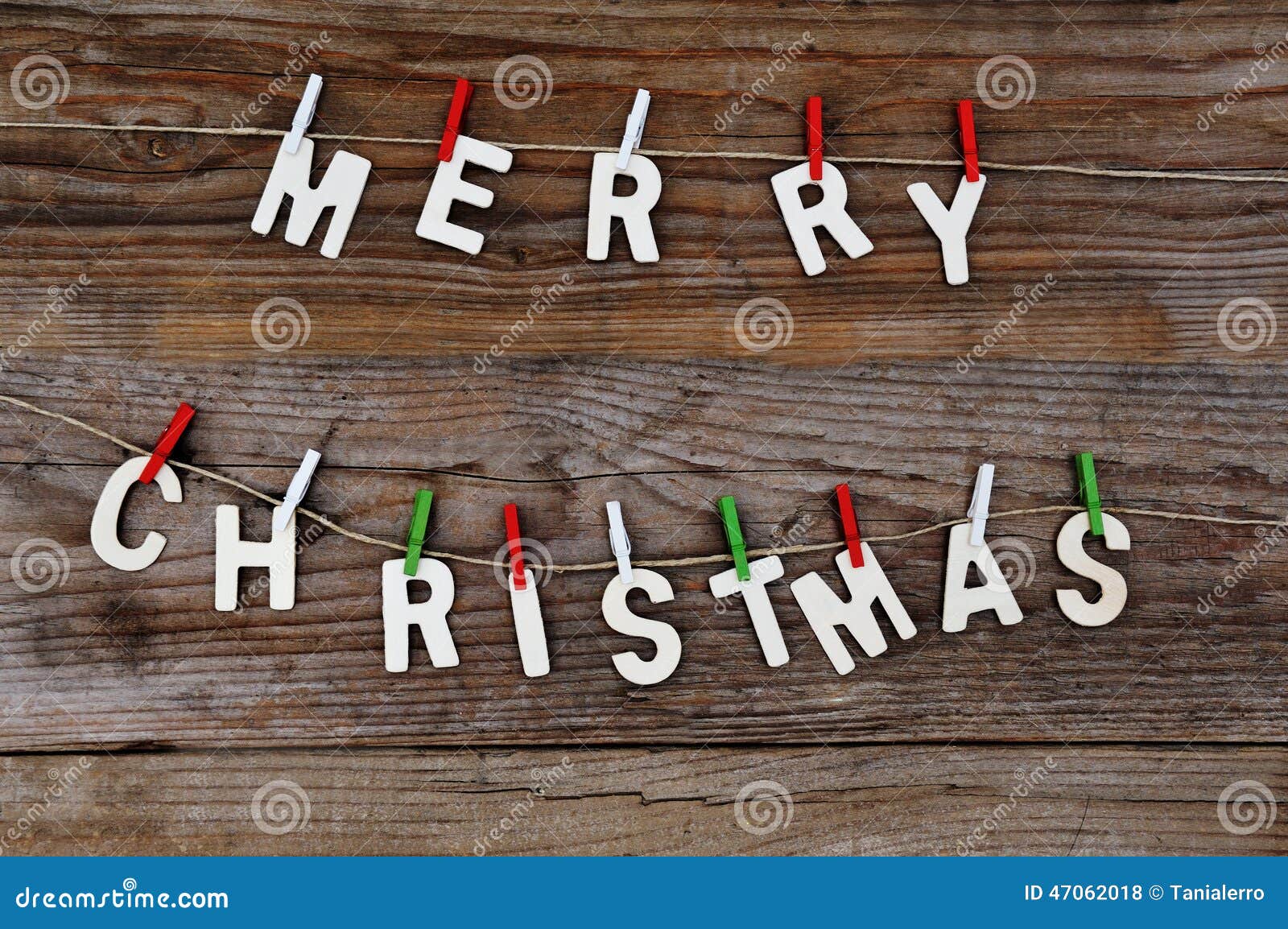 Merry Christmas greeting message on wooden background Download preview