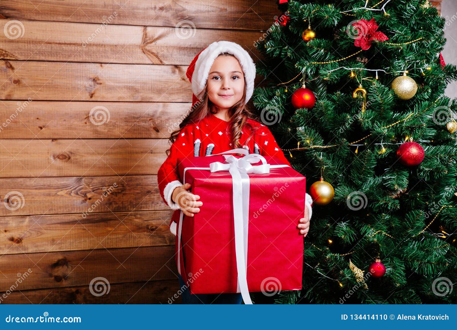 Merry Christmas And Happy Holiday Cute Little Child Girl With Big Red