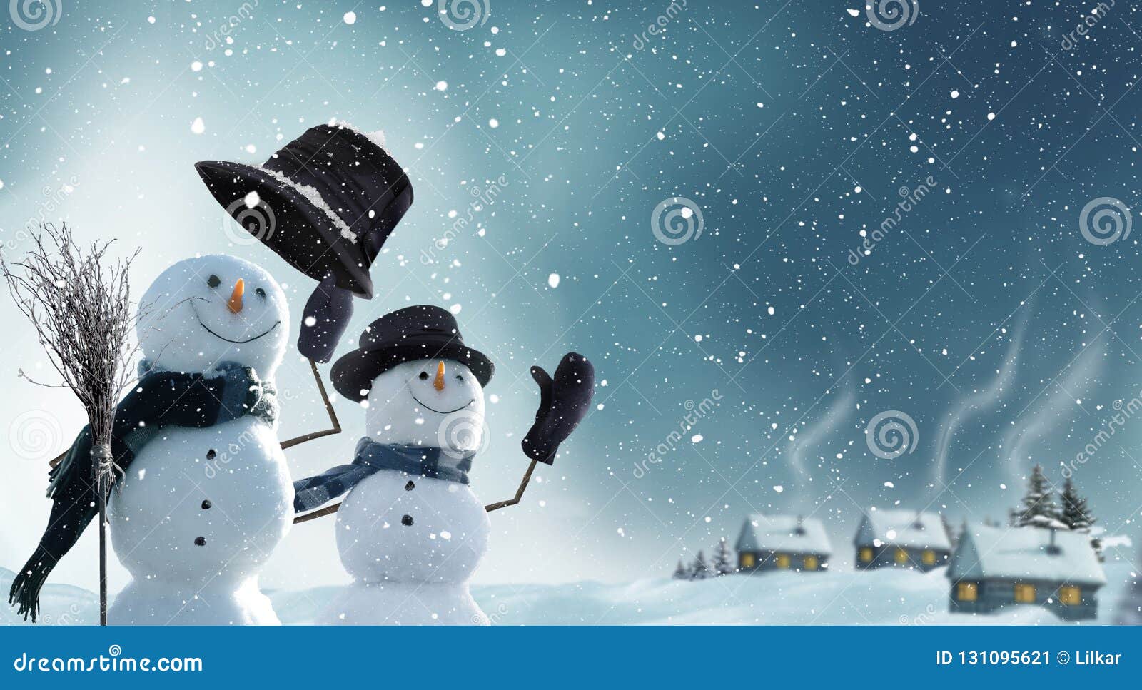 two snowmen standing in winter christmas landscape.