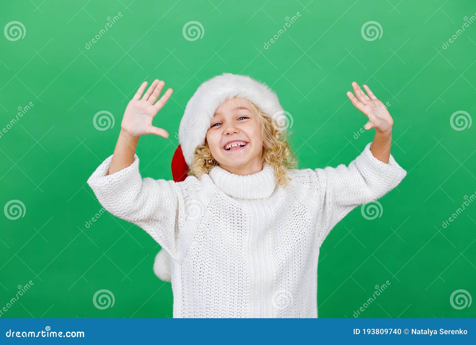 Merry Christmas Little Girl in Santa Hat on Bright Green Vivid Color ...
