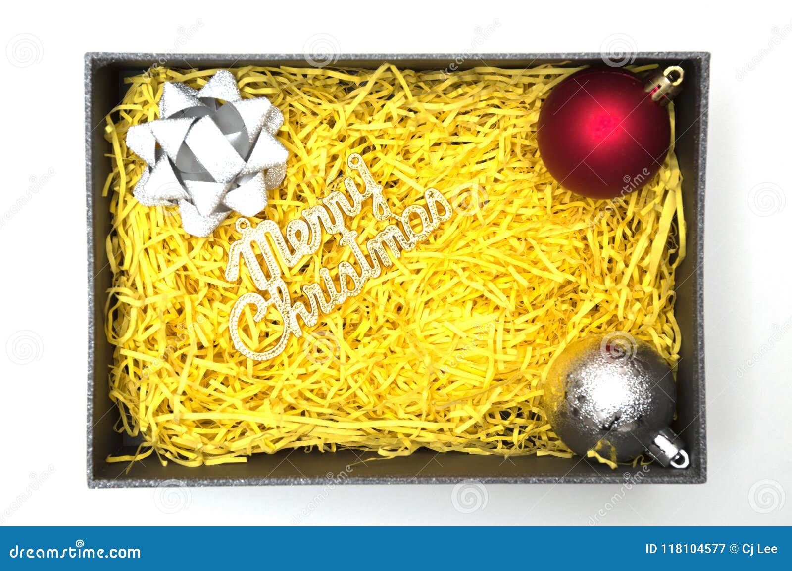 Merry christmas text and ribbon ball in black t box with yel