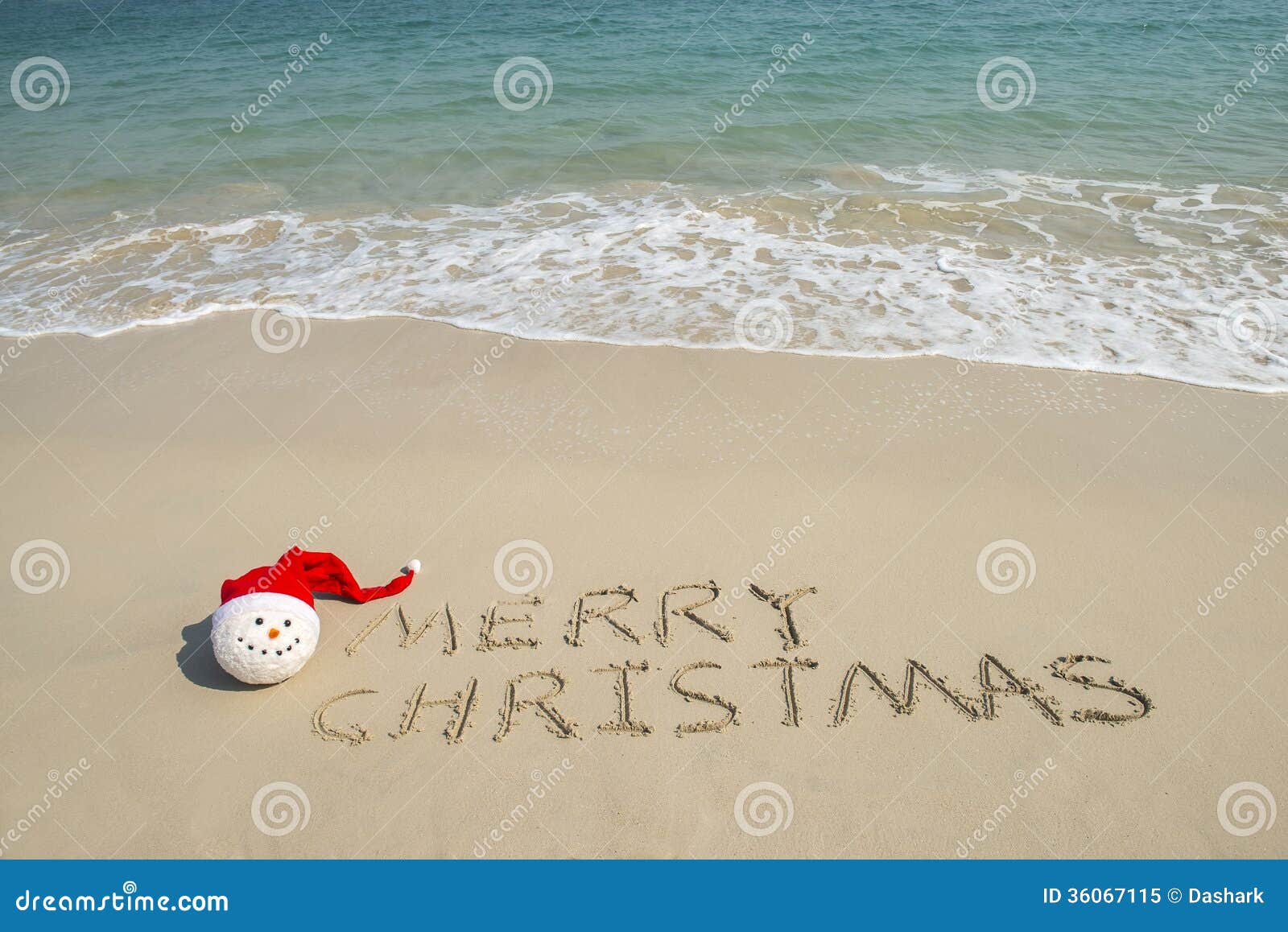 Merry Christmas Written on Tropical Beach White Sand with Snowman Stock Merry Christmas Beach