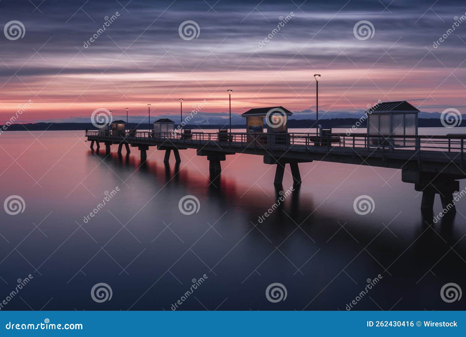 mesmerizing scene of the sunset on the empty bridge in edmonds, washington