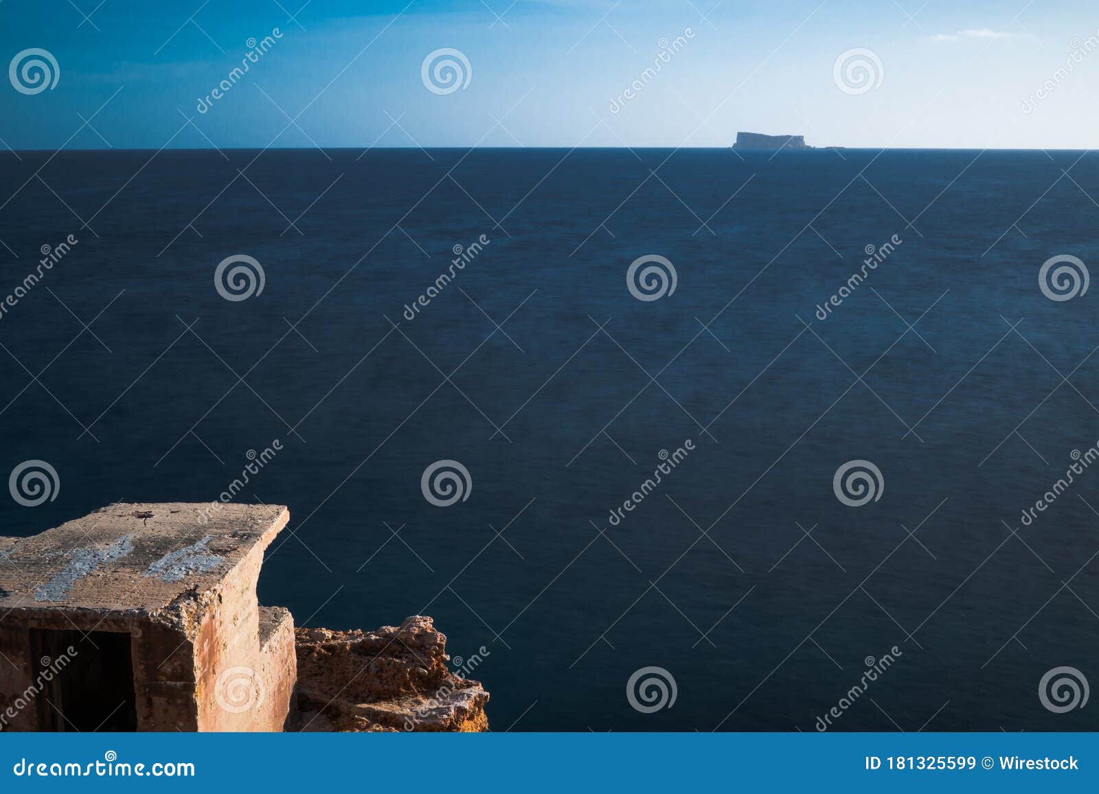 mesmerizing view of the old caves of ghar lapsi and the calm sea in malta