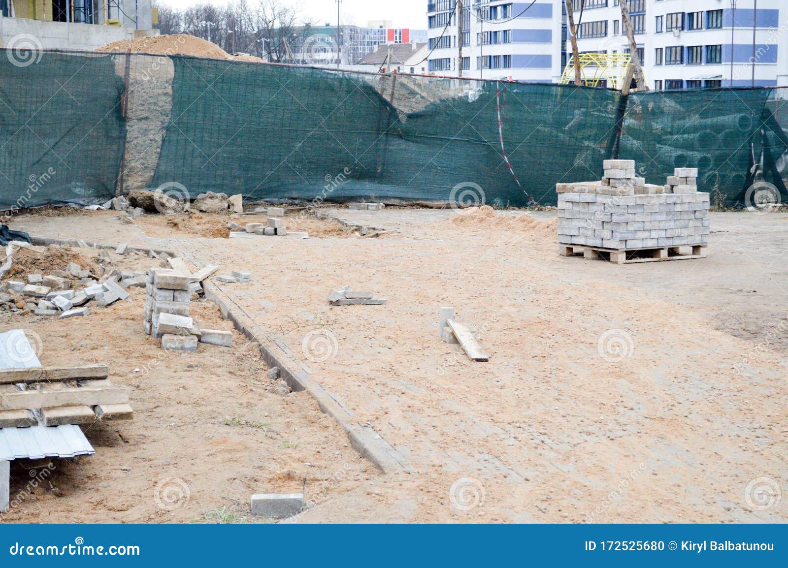 A Mess at a Construction Site with Scattered Building Materials and ...