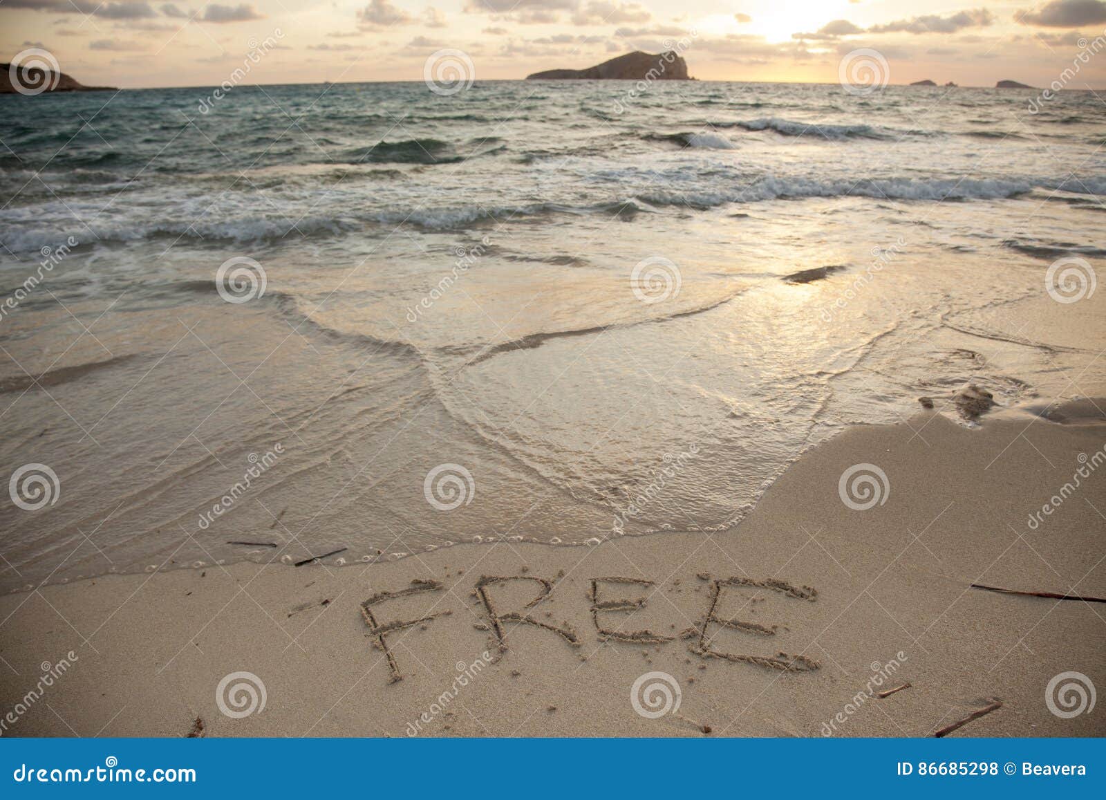 Message Of Freedom Written On The Sand On A Summer Day Stock Photo