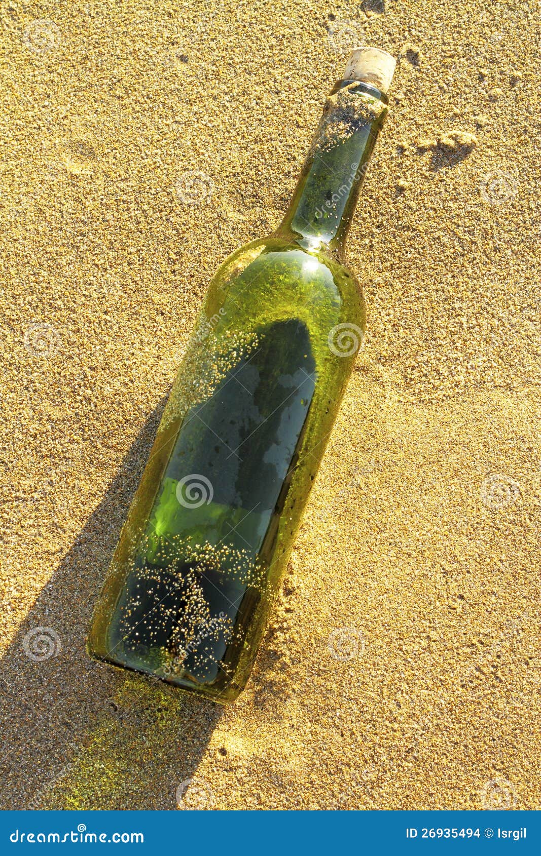 Message in a glass bottle in a beach. Message in a glass bottle in a solitary beach near the sea