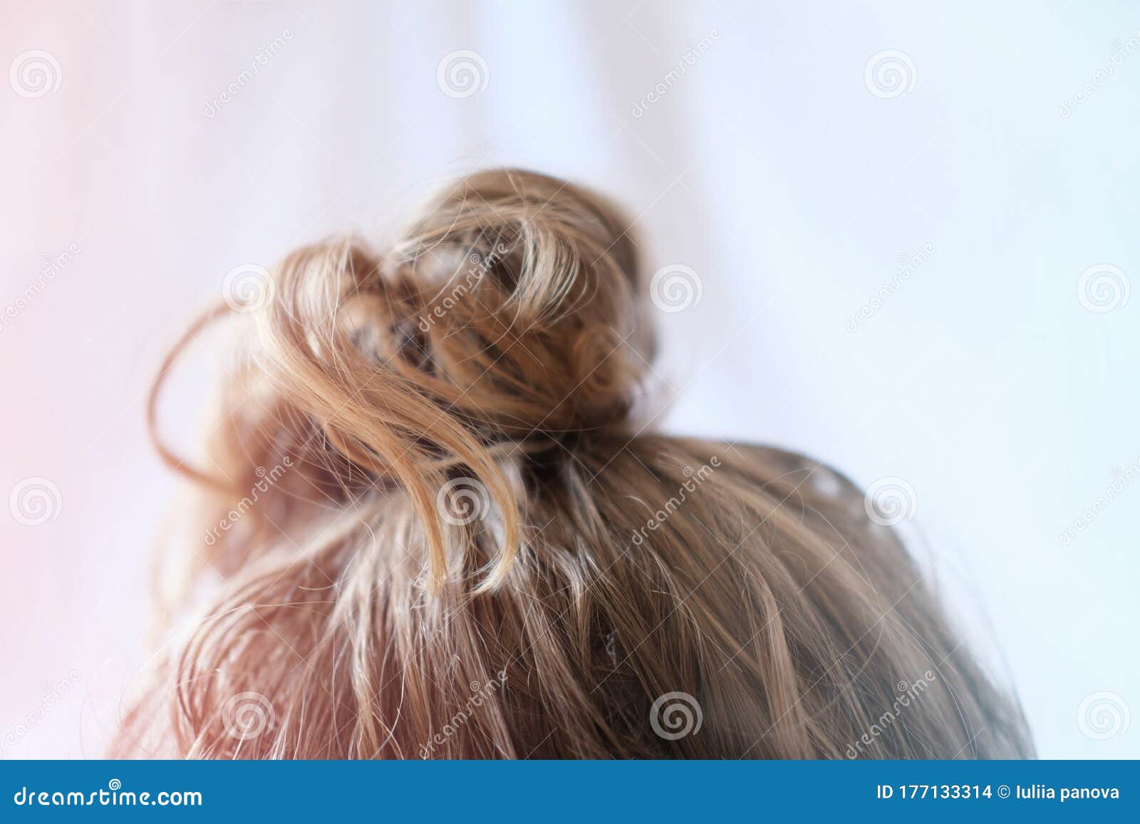 Messy Bun on the Head of a Blonde Woman. Slightly Curly Hair. Stock Photo - Image of creative, hipster: 177133314 Messy Bun on the Head of a Blonde Woman. Slightly Curly Hair. Stock Photo - Image of creative, hipster: 177133314