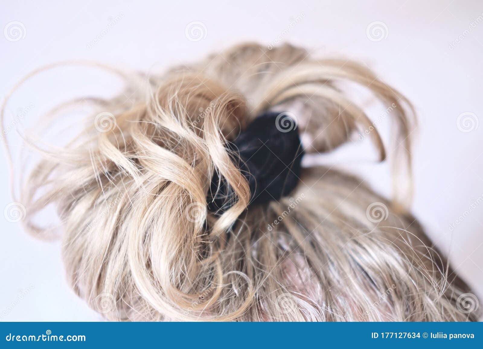 Messy Bun on the Head of a Blonde Woman. Slightly Curly Hair Stock Photo -  Image of head, color: 177127634