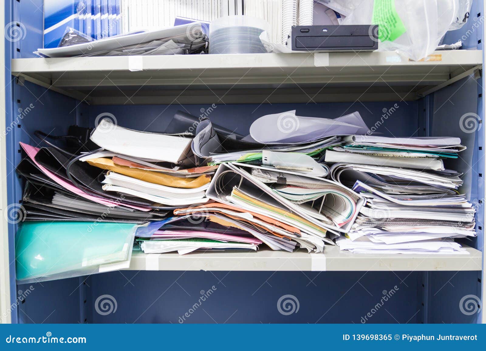 Messy File Document And Office Supplies In Filing Cabinets Stock