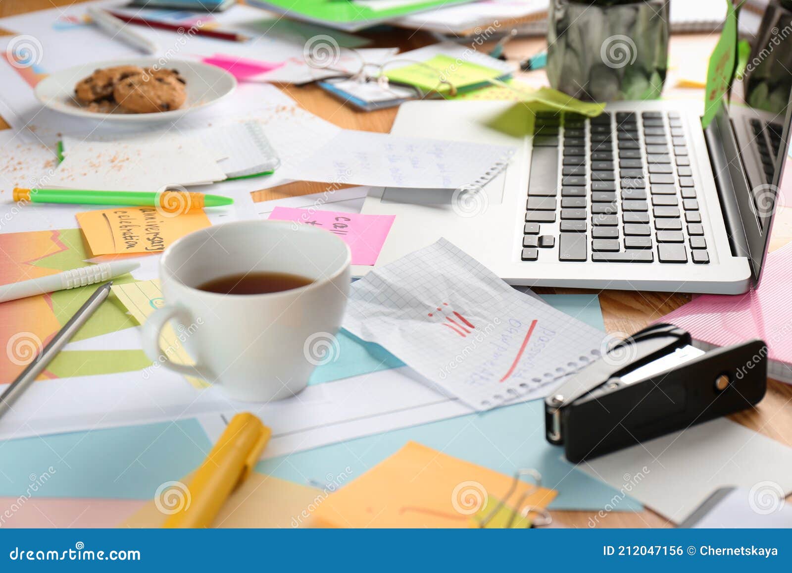Office Desk with Laptop with Business Accessories and Cup of Tea