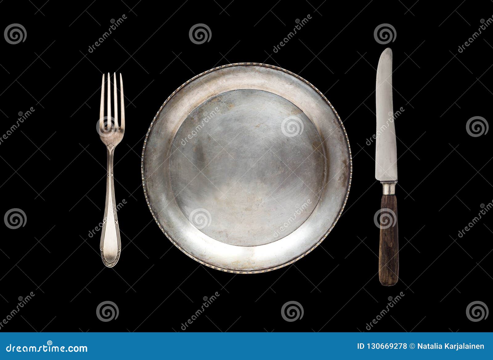 Metal Antique Plate, Knife And Fork Isolated On A Black Background