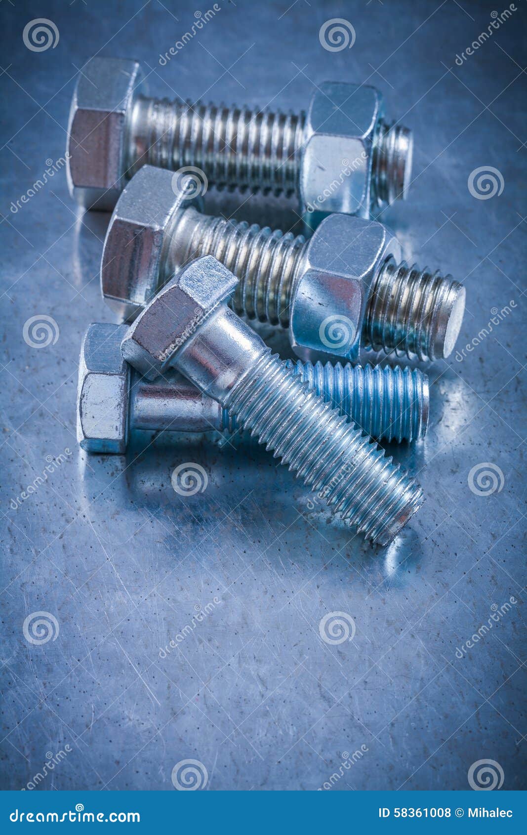 Metal Bolts and Nuts on Scratched Metallic Surface Construction Stock