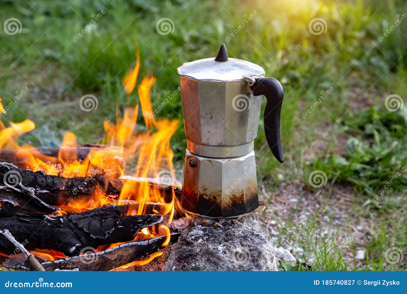 Metal Coffee Maker on an Open Fire in Nature. Making Coffee Stock