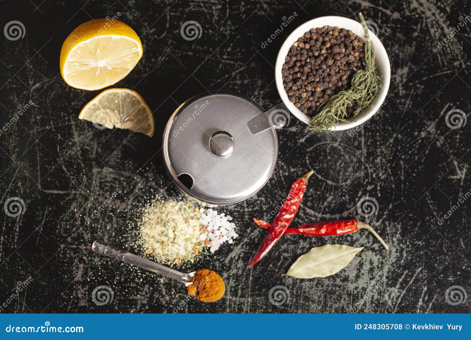 Metal Container for Spices with Assortment of Spices for Cooking on a