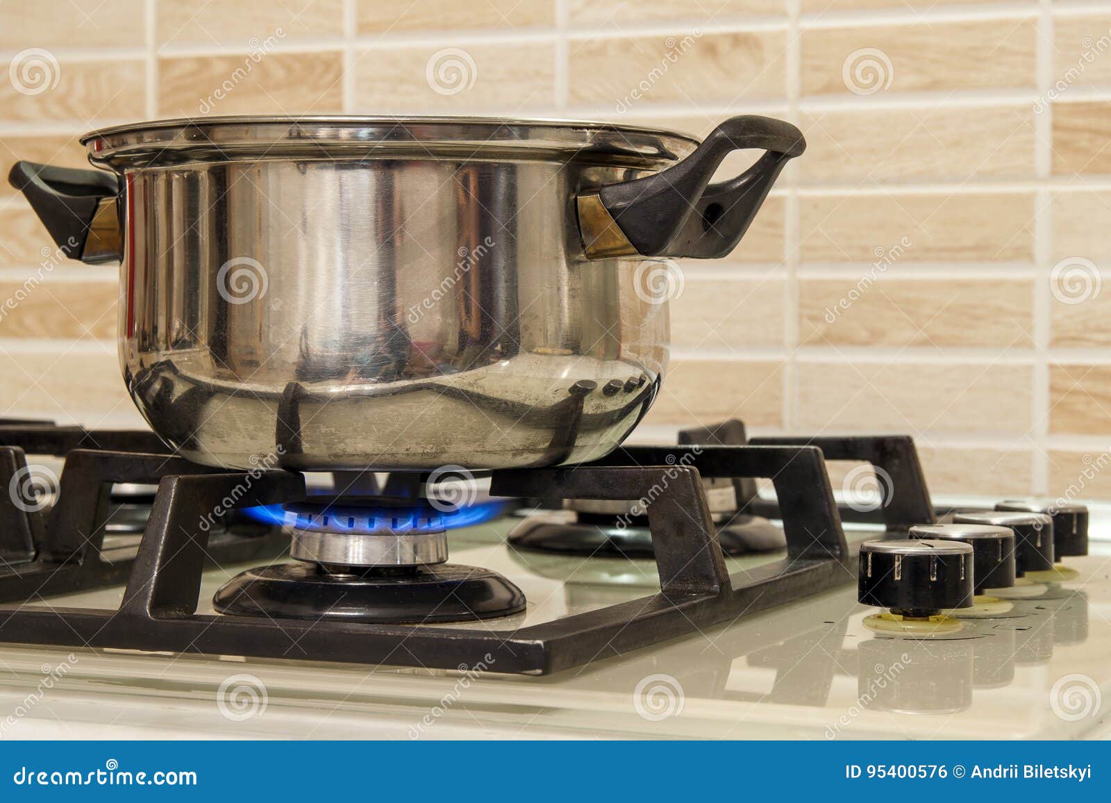 Metal Cooking Pot Standing on Kitchen Stove with Flame. Stock Photo ...