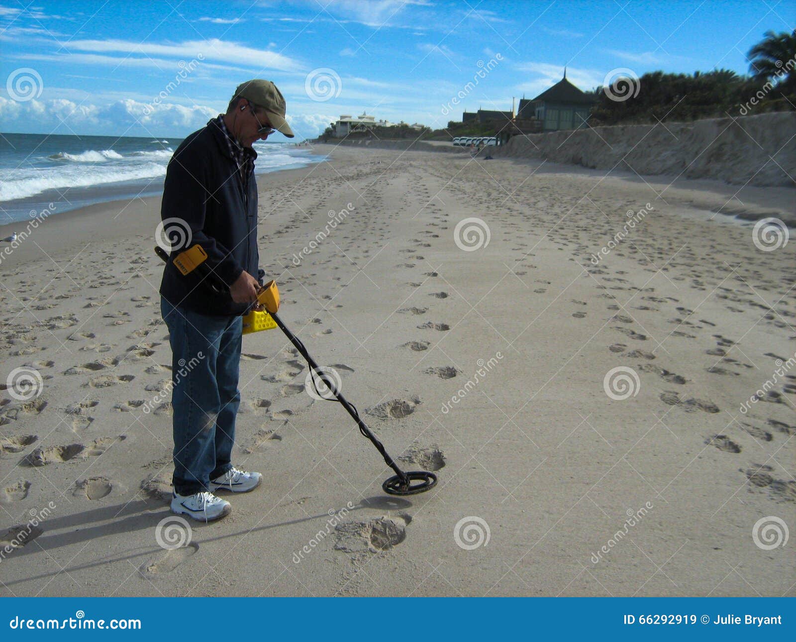 Metal Detecting at Beach stock image. Image of coins 66292919