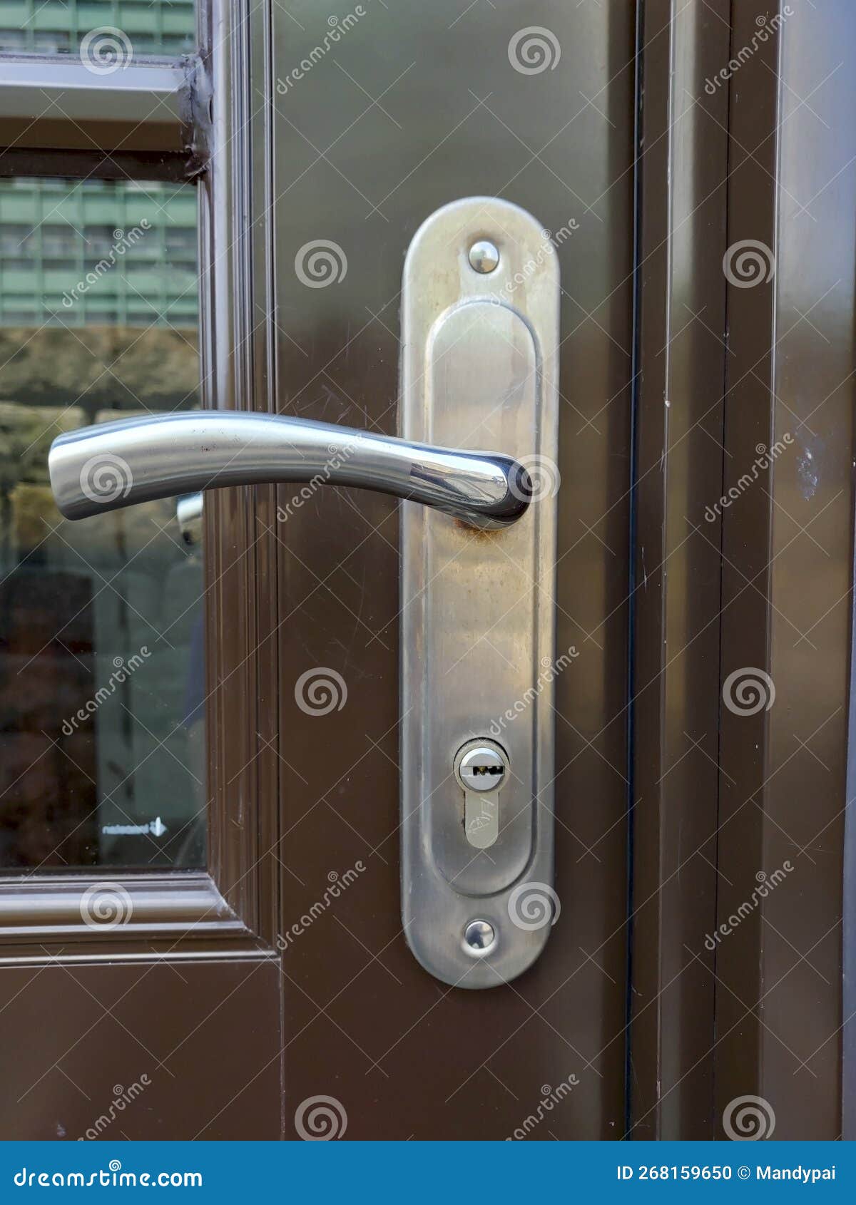Metal door handle and lock stock photo. Image of column 268159650