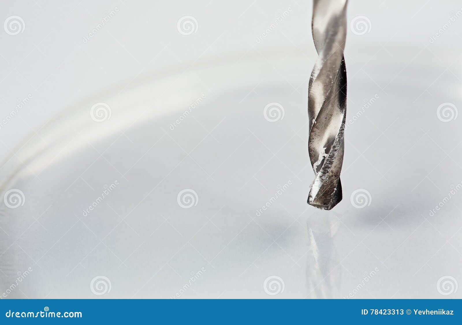 Metal Drill Bit Makes a Hole in a Piece of Plastic Stock Image Image