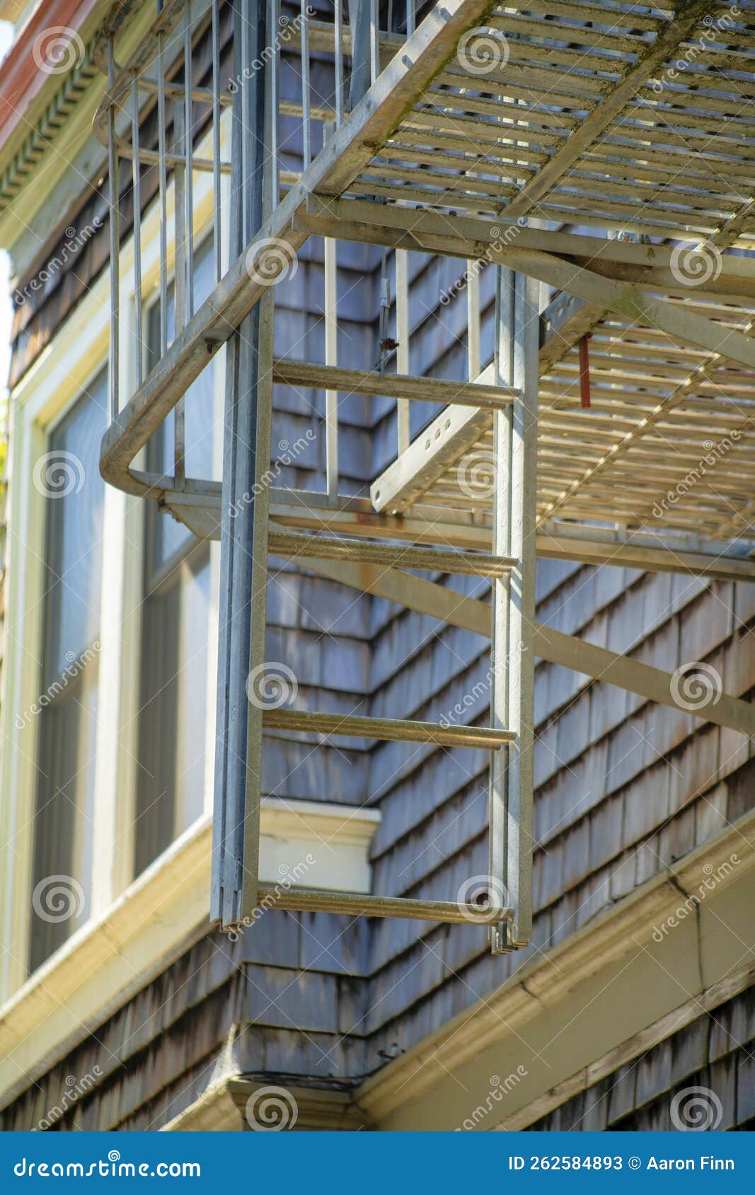 Metal Fire Escape Ladder on Saftey Balcony with Steps and Slatted Aged Wood  or Weathered Timber on Home Exterior Stock Image - Image of house, rural:  262584893