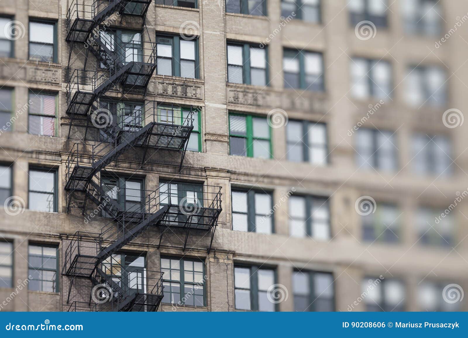 Metal Fire Escape Outside Apartment Building for Emergency Stock Photo