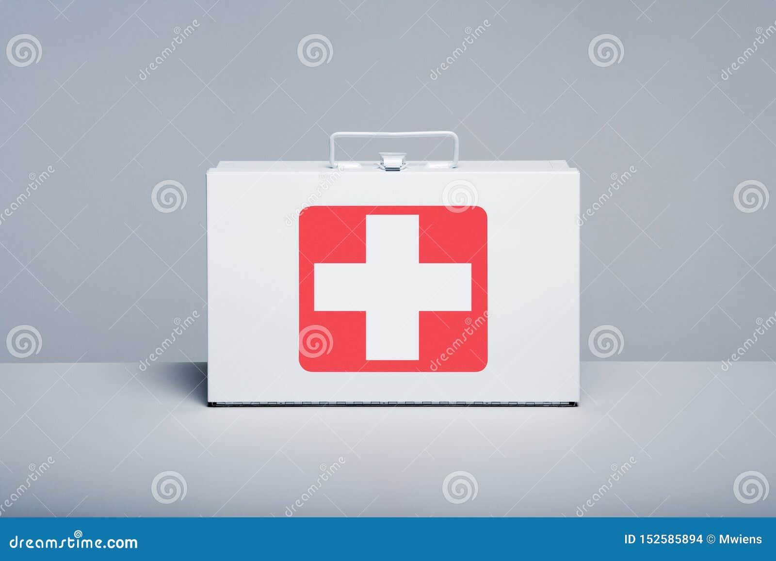 metal first aid kit on grey background