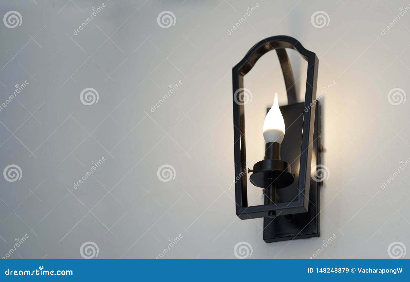 Metal Frame Wall Lamp with Light Bulb on Bottom View Stock Image