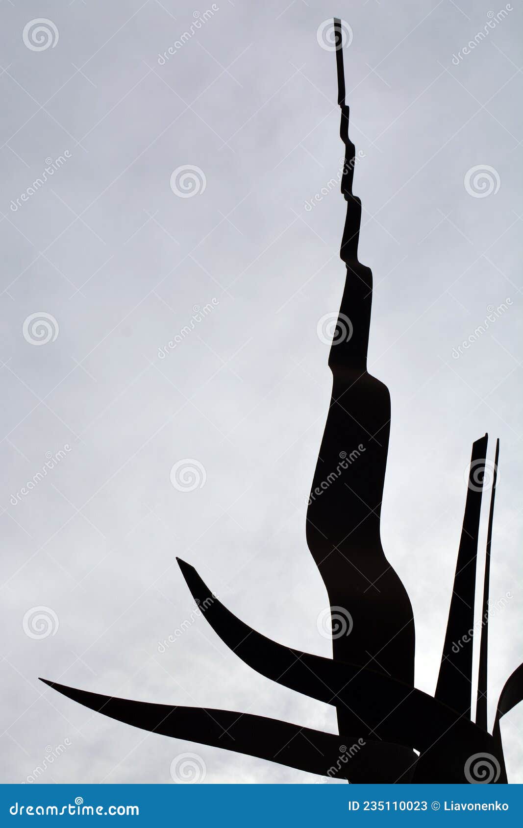 metal monument. on the sky background. peace park almada portugal. monumento de ferro. parque de paz. cÃÂ©u nublado.