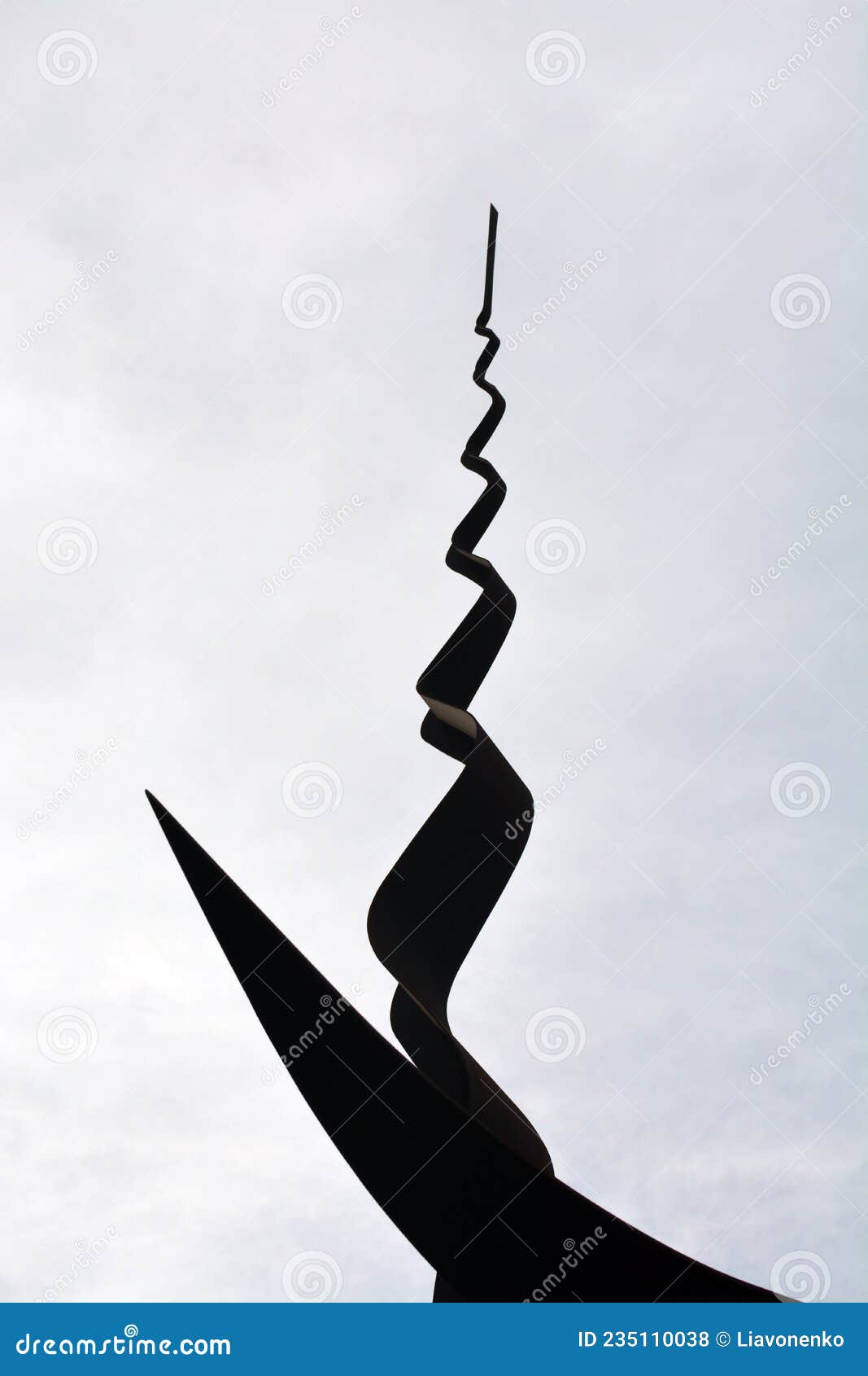 metal monument. on the sky background. peace park almada portugal. monumento de ferro. parque de paz. cÃÂ©u nublado.