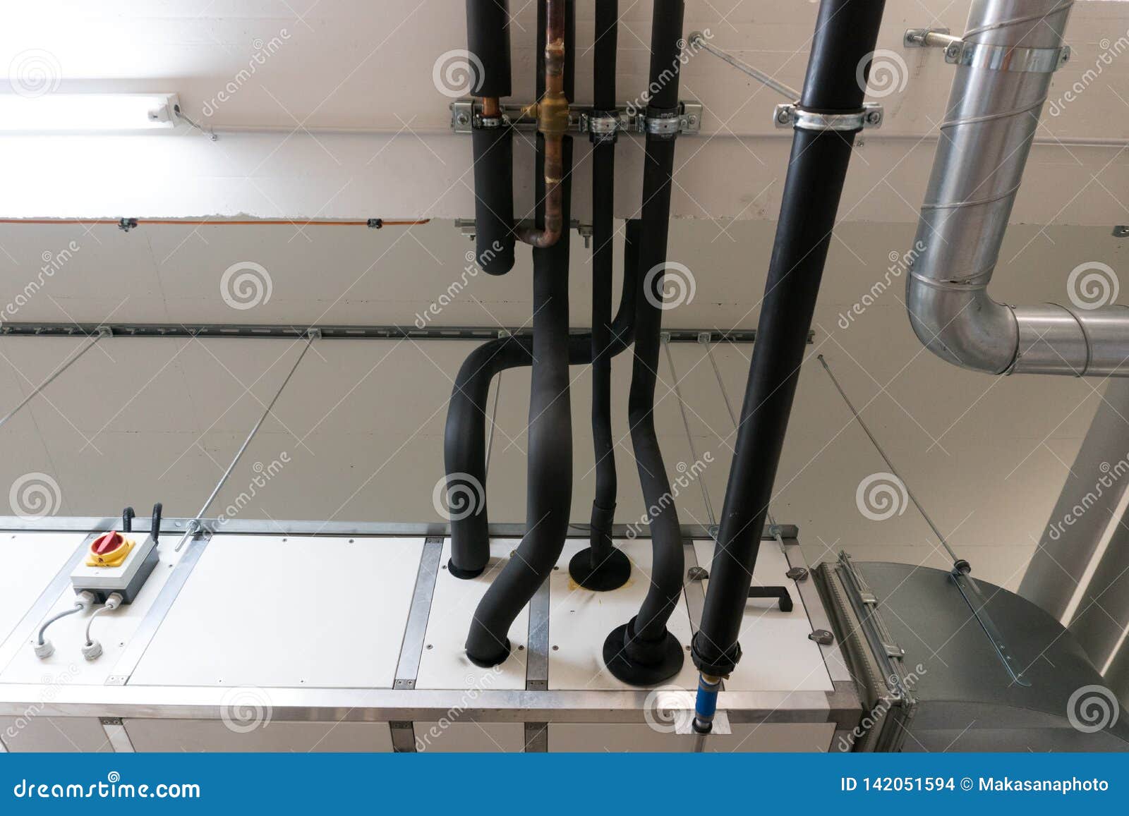 Metal and Plastic Pipe System on the Cellar Ceiling of an Apartment