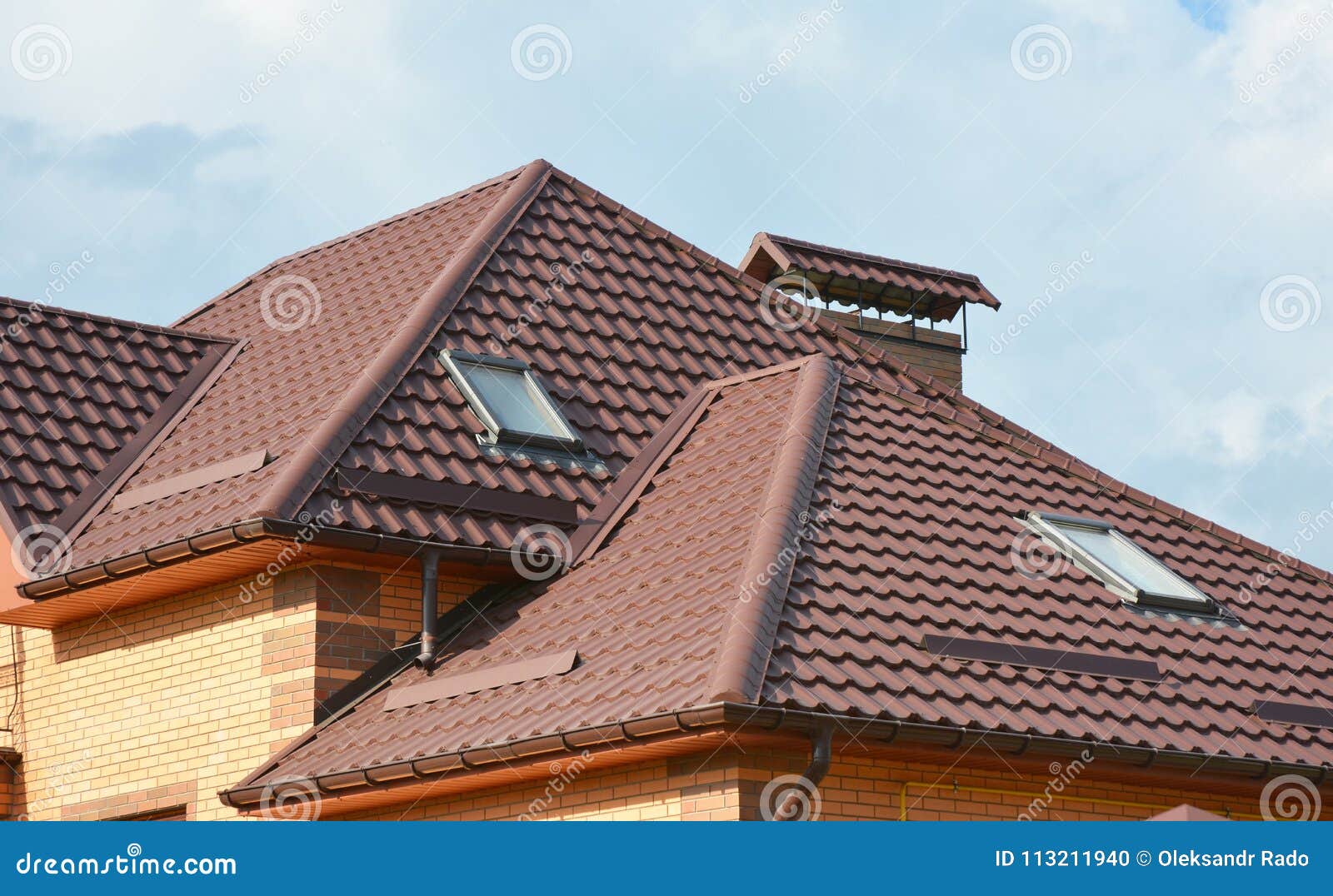 metal roof with modern house attic construction with roof guttering and attic skylight window. attic skylights.