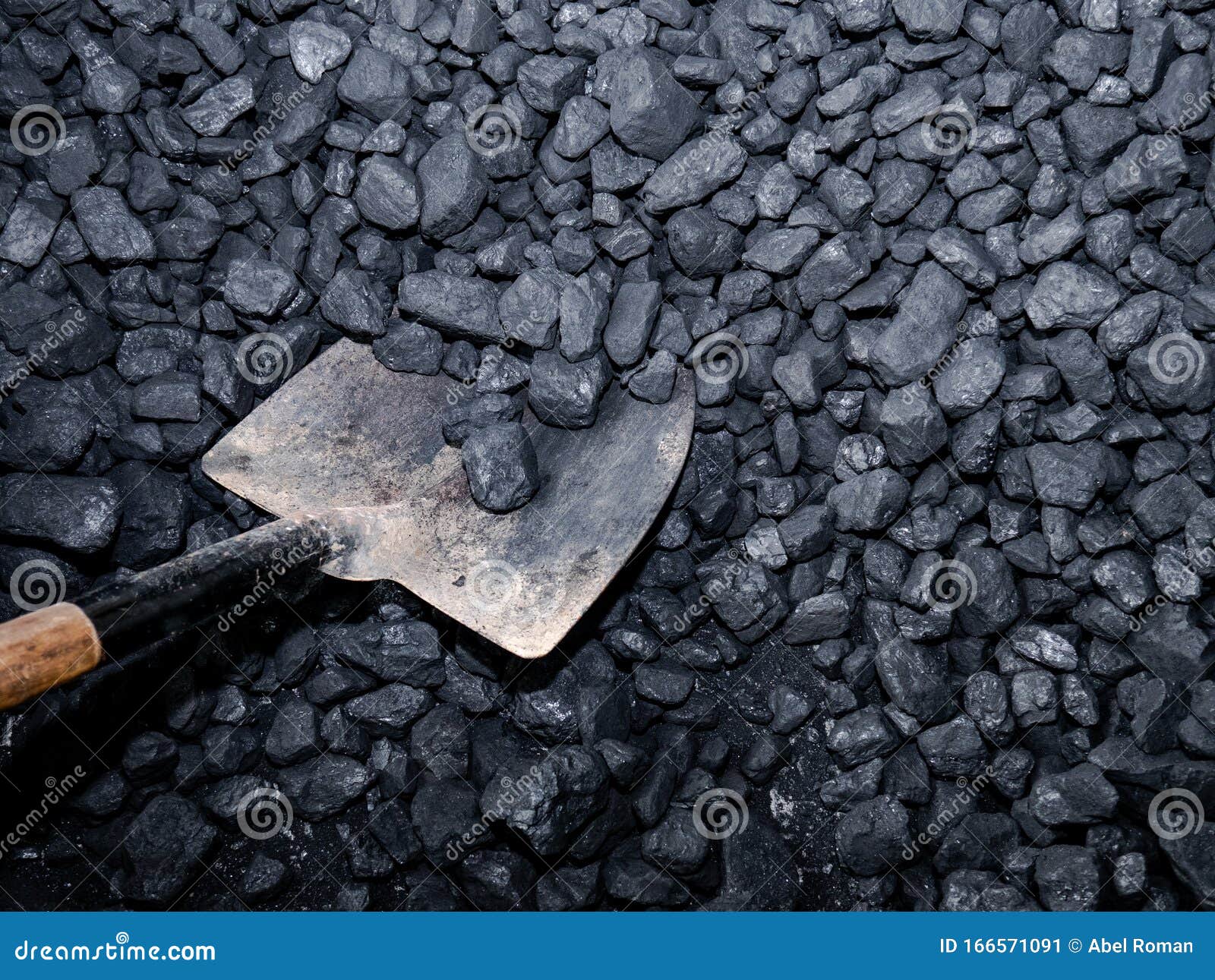 picking up carbon with a shovel