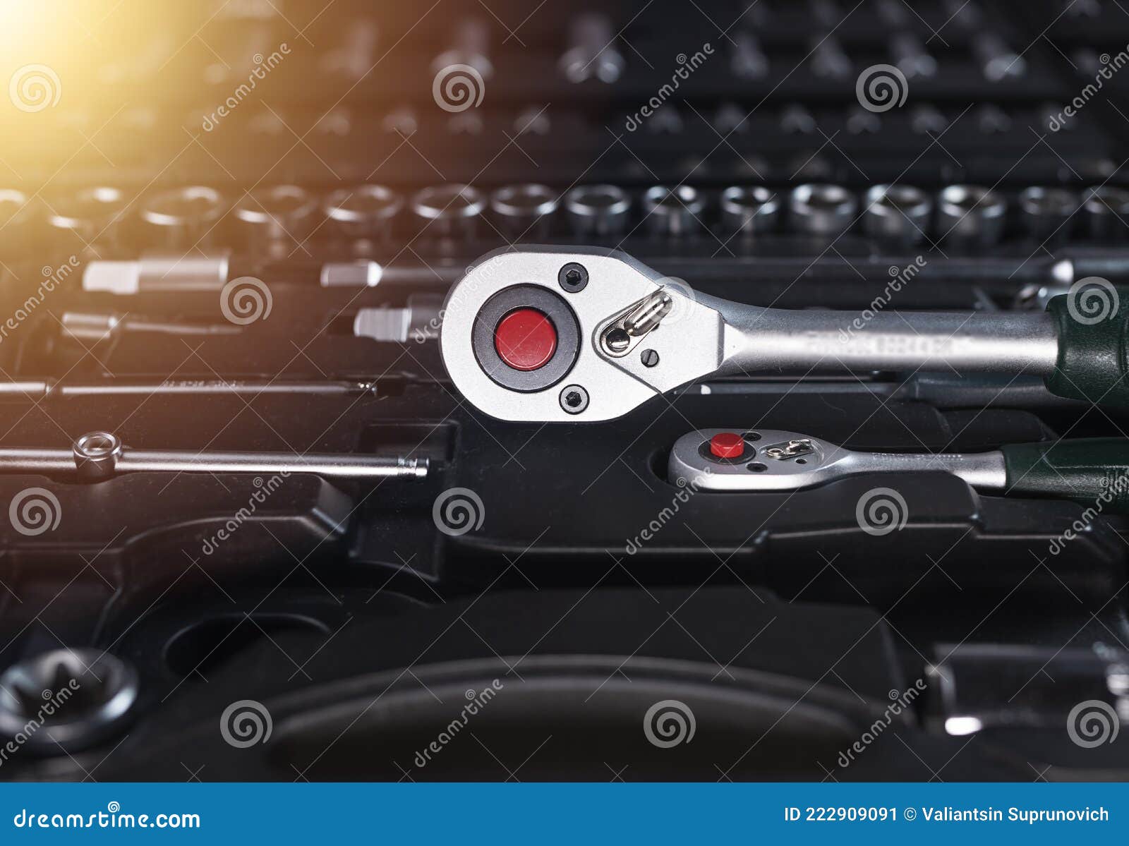 Metal Socket Ratchet Handle on Black Toolkit with Steel Tools, Closeup