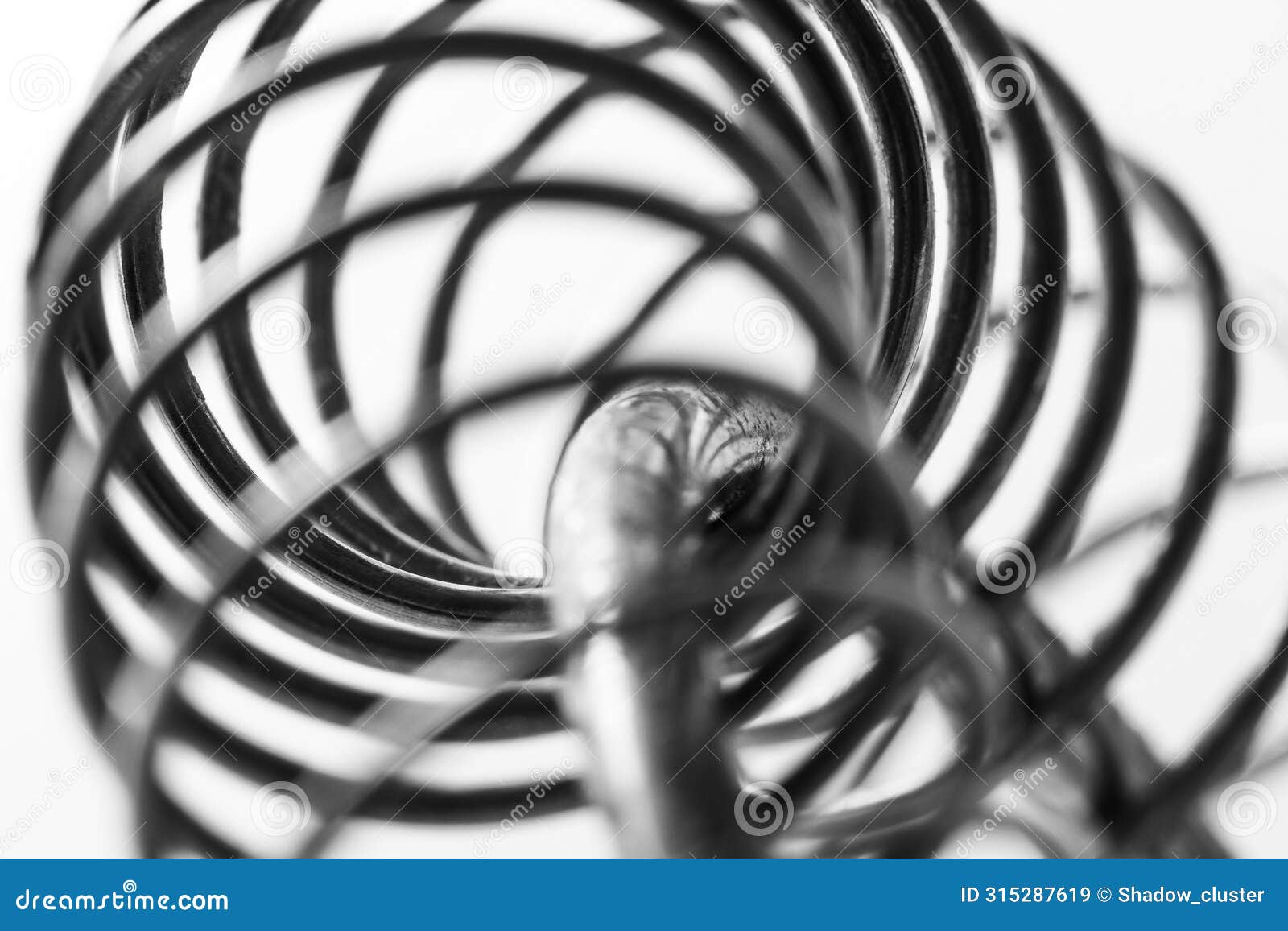 metal spring coiled, black and white macro shot