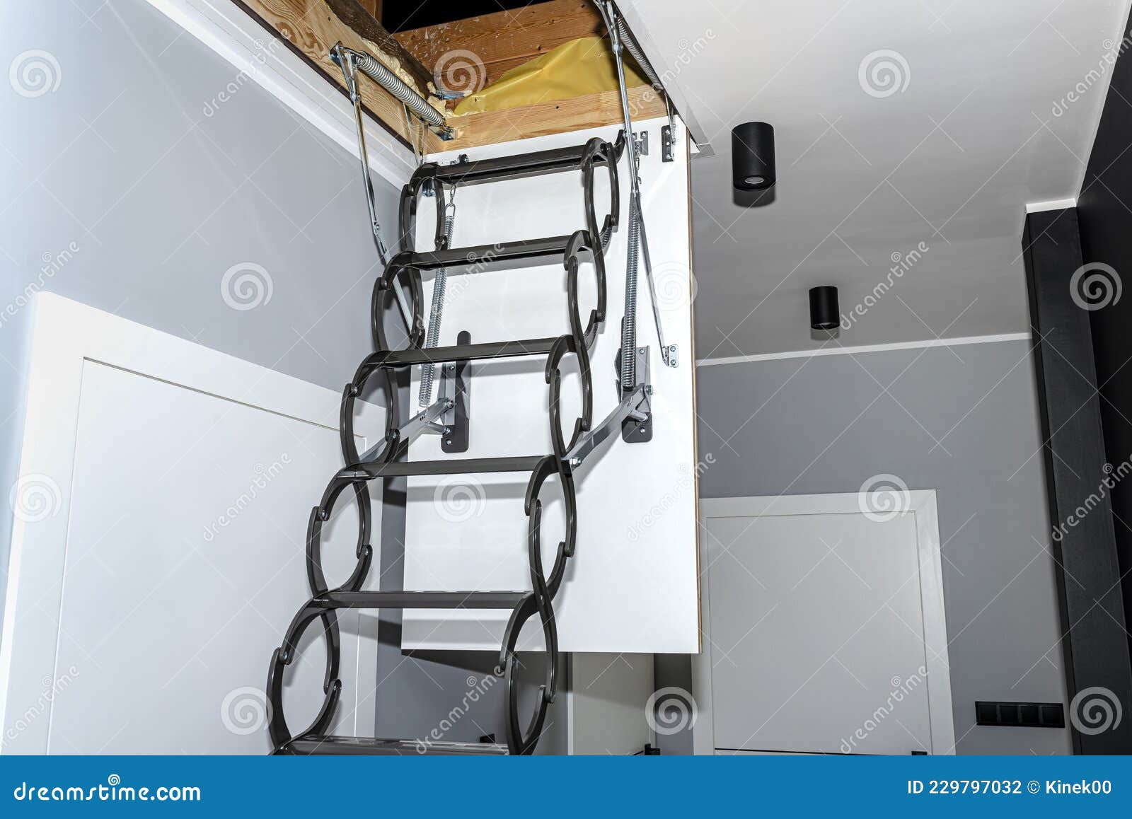 Metal Stairs Hidden in the Ceiling To the Attic with an Opening Hatch and  Folding Stairs in the Corridor, Modern Look. Stock Photo - Image of steel,  corridor: 229797032