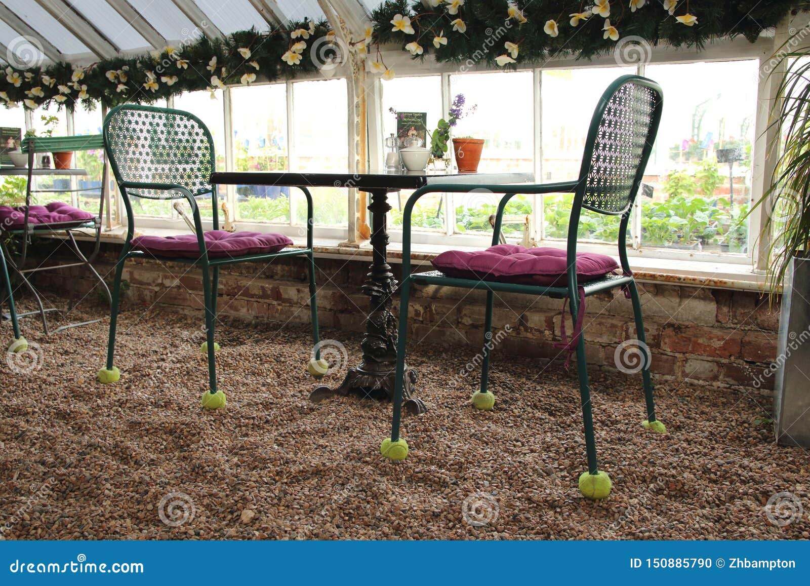 Metal Table And Chairs In A Garden Centre Coffee Shop Stock Photo