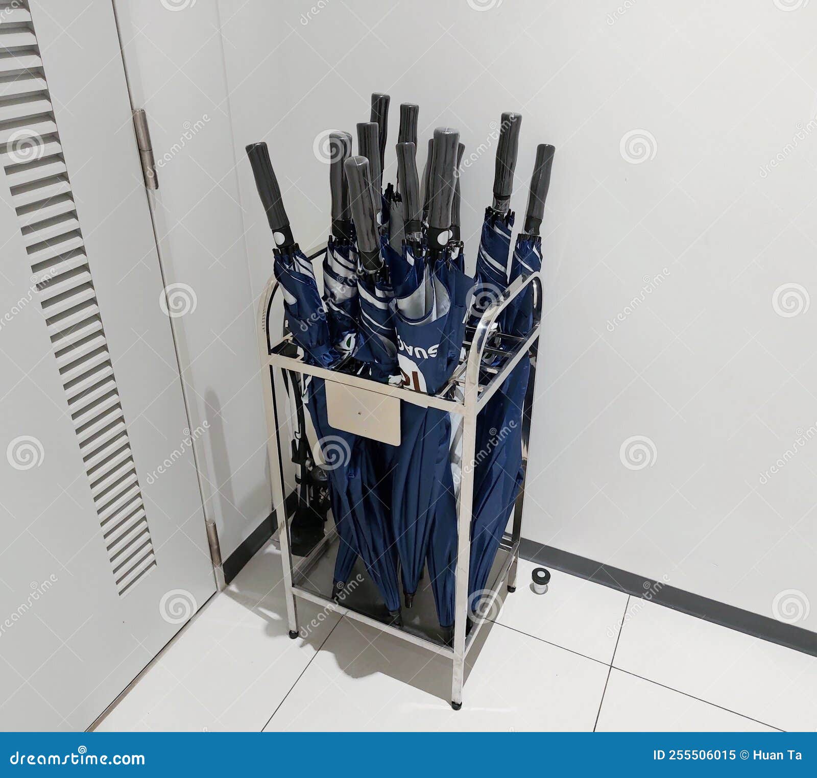 A Metal Umbrella Basket Holder in Office Building Stock Image Image