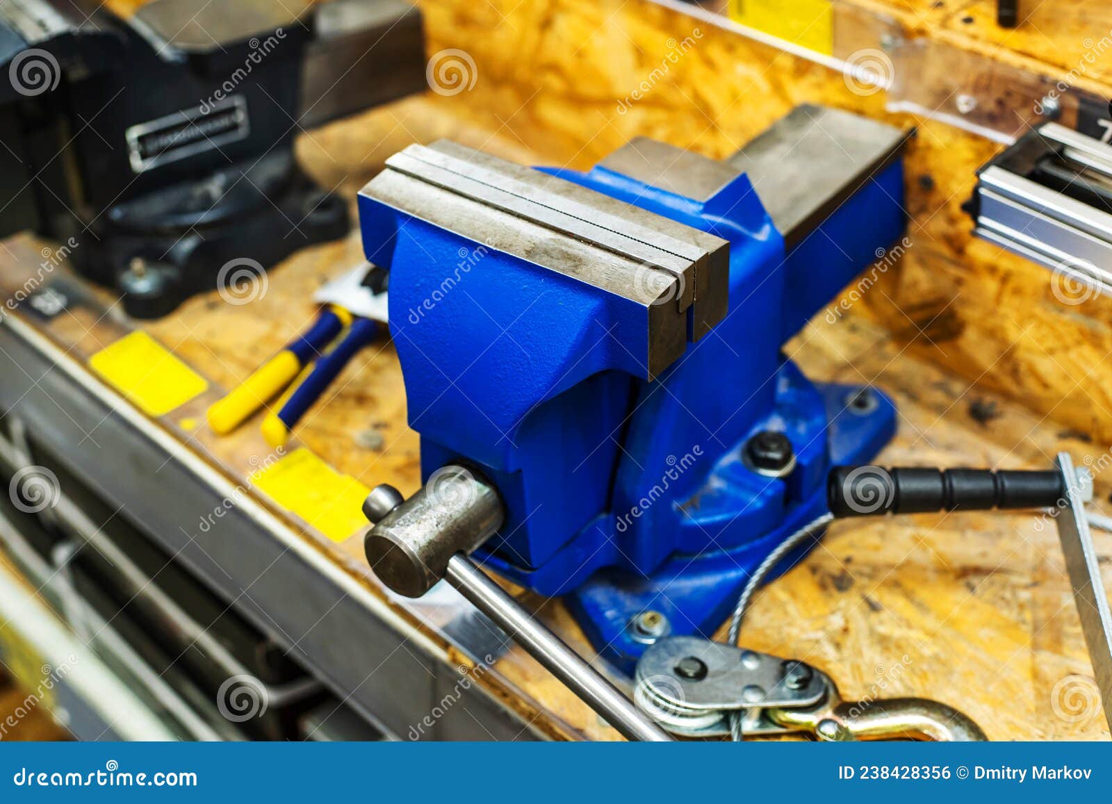 Metal Vise on a Workbench. Equipment for Fixing Parts during Processing