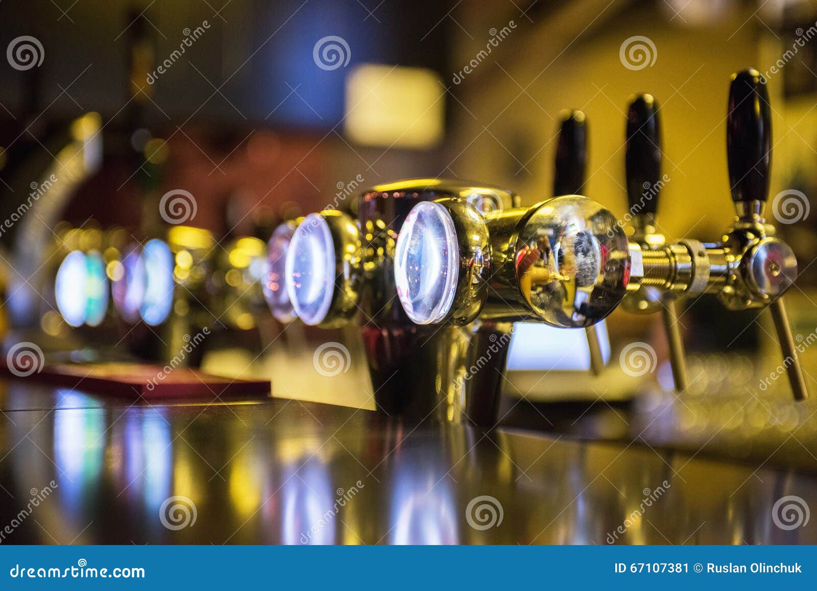 Metallic beer taps stock image. Image of background, liquid 67107381