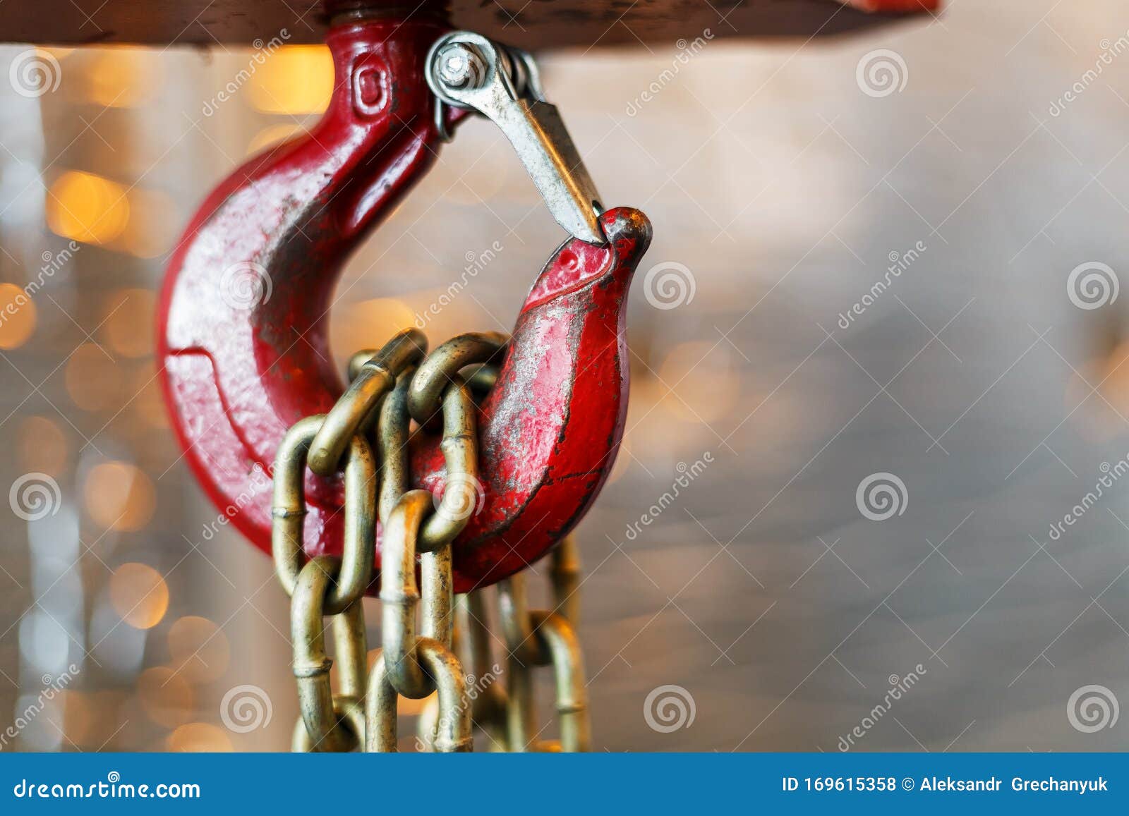 Metallic Chain Handle with Red Hook in Technical Room. Crane Cargo Hook