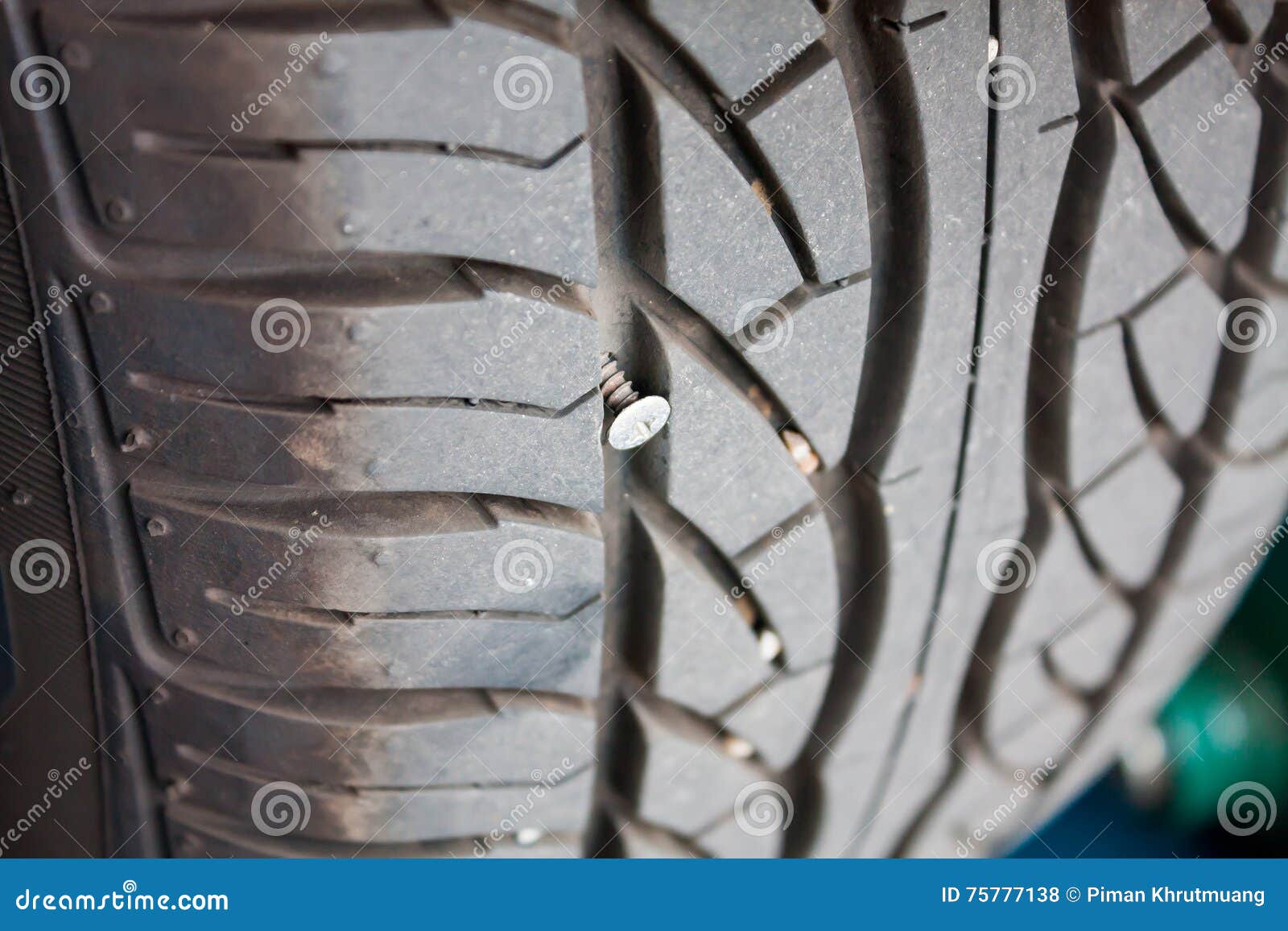Metallic nail in car tyre stock photo. Image of spike - 75777138