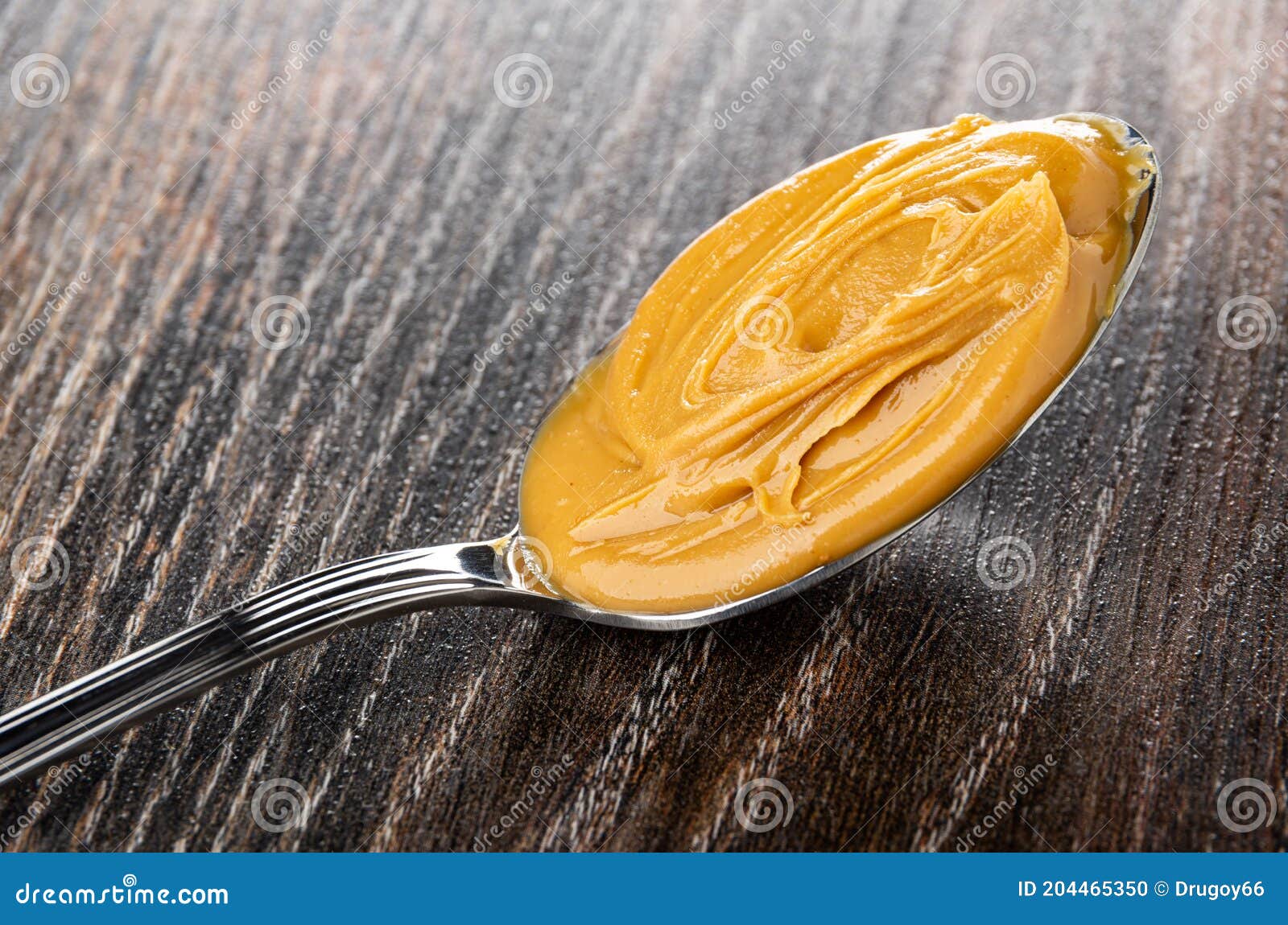 Spoon with Peanut Butter on Wooden Table Stock Photo Image of bowl