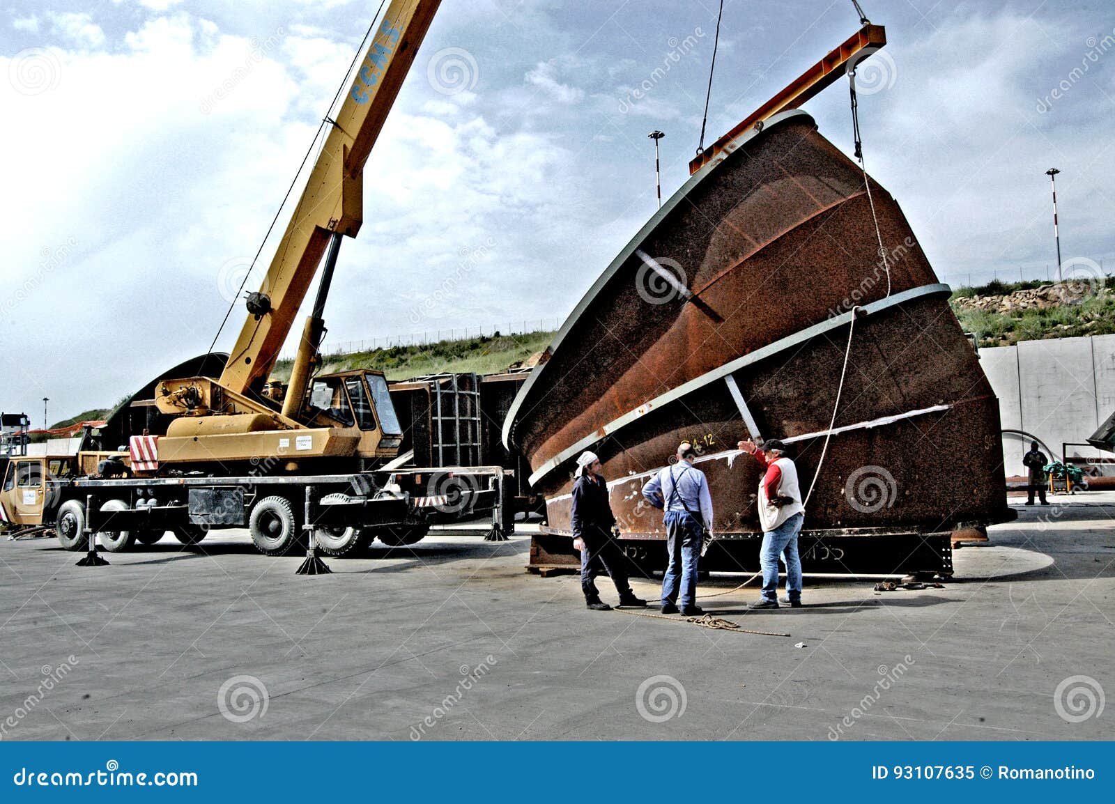 Metalwork Construction of Large Tubes with Workers Working Welding