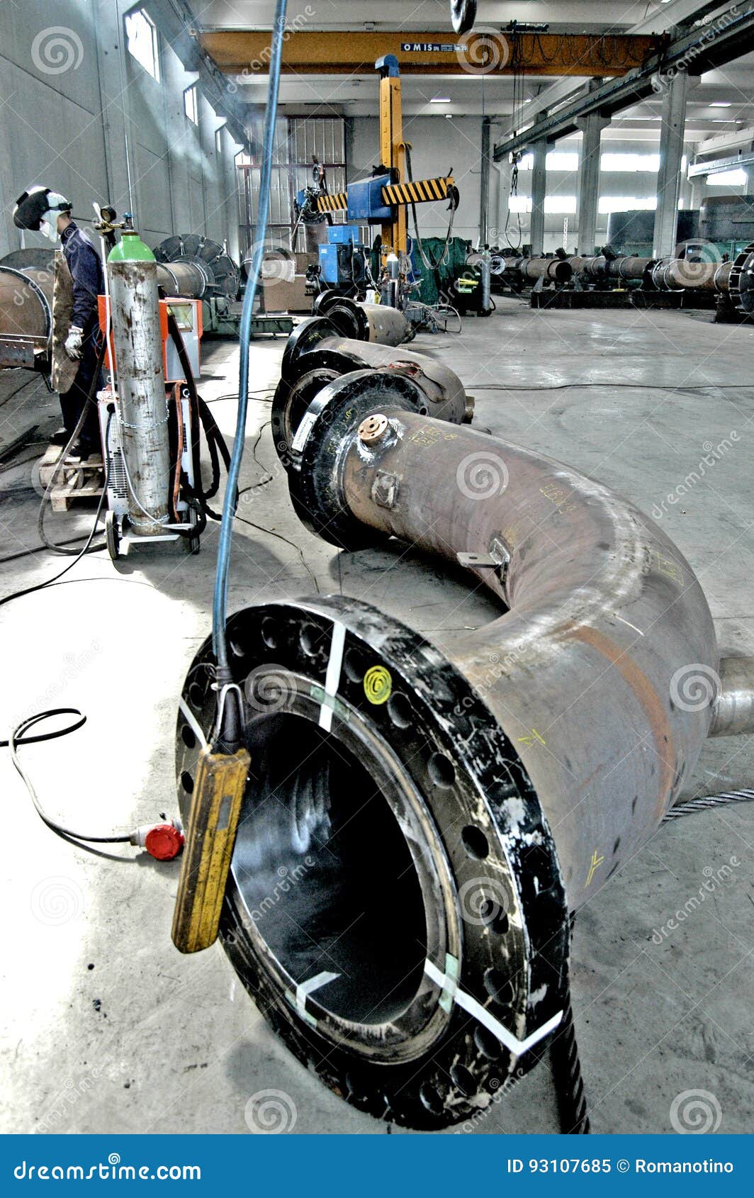 Metalwork Construction of Large Tubes with Workers Working Welding