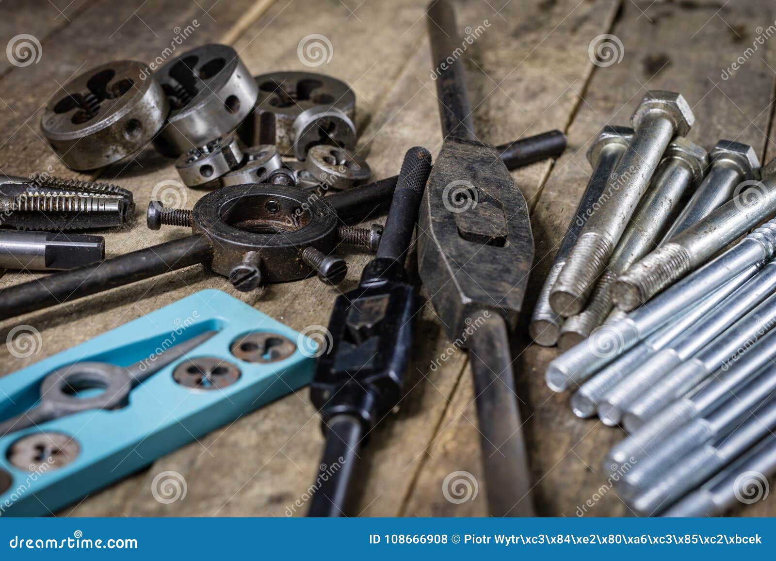 Metalwork Tools on the Table. Threading Dies and Taps I Stock