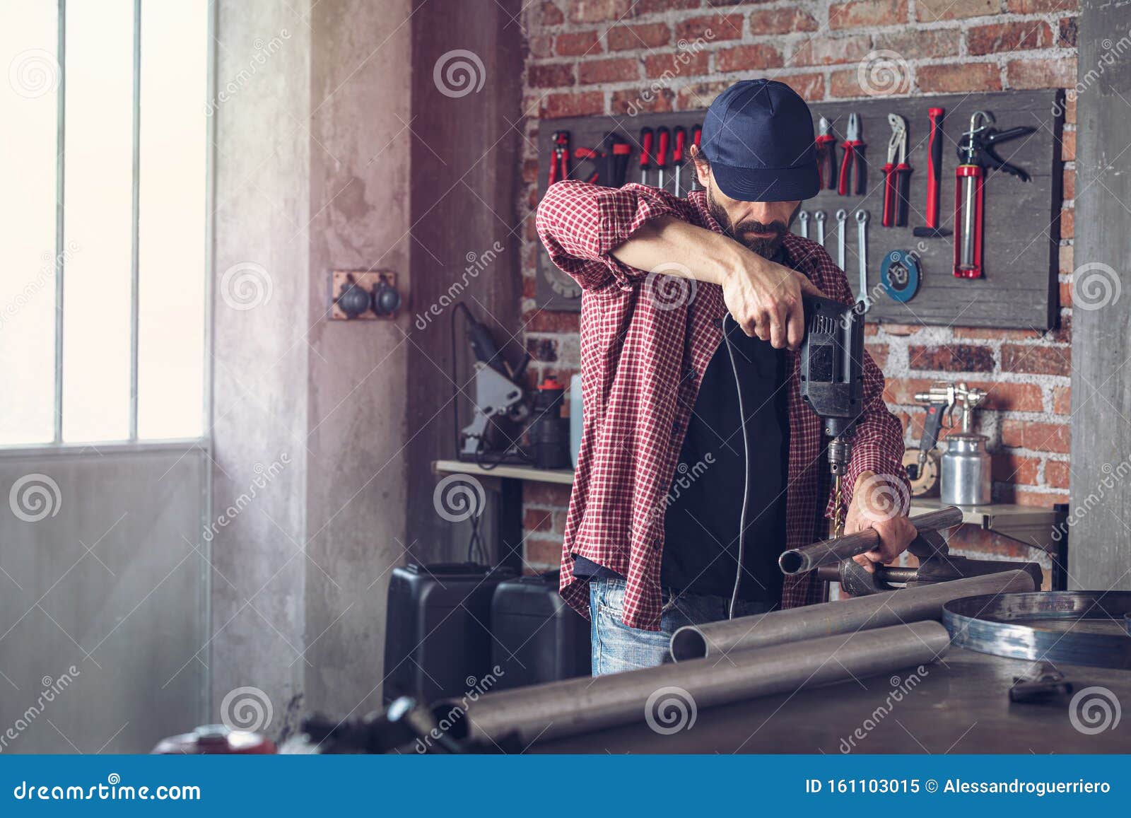 Metalworker Drilling a Hole in a Metal Pipe Stock Image Image of