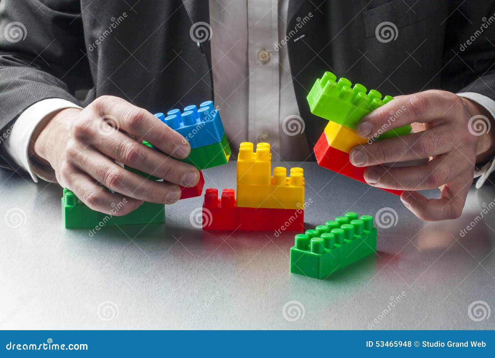 Metaphor for Real Estate or Architecture with Focus on Hands Stock