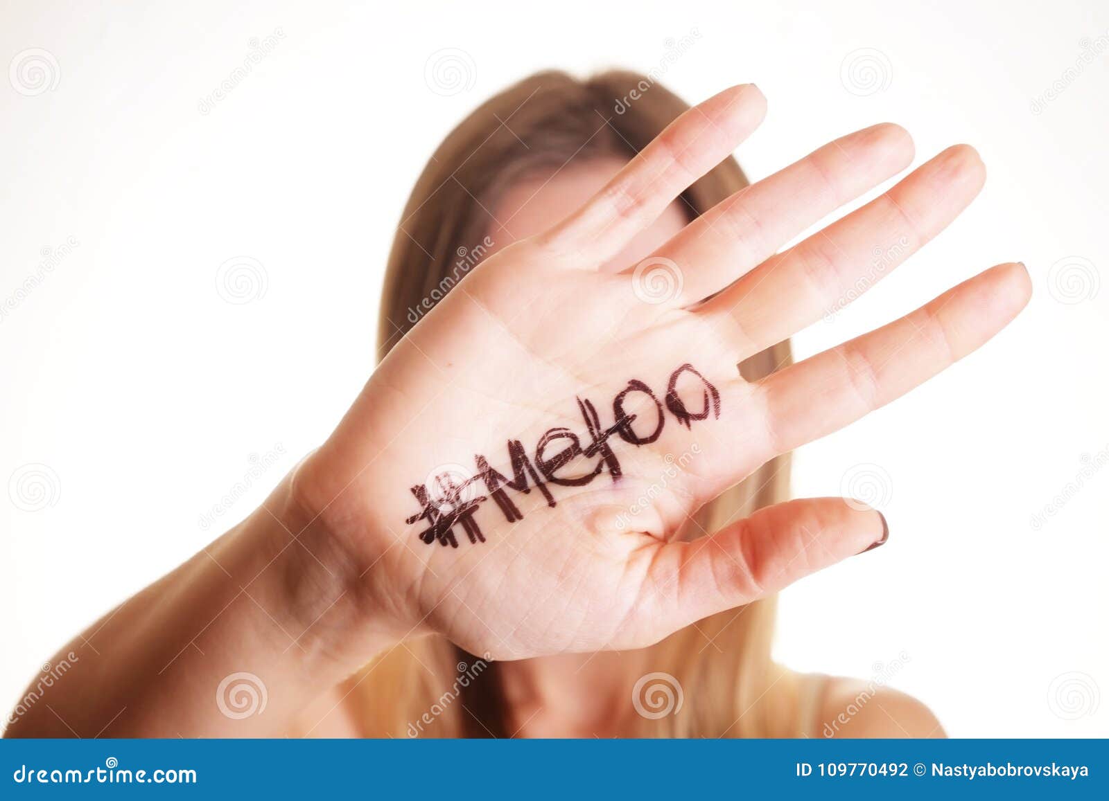 ` metoo` text in woman`s hands. female empowering movement concept.